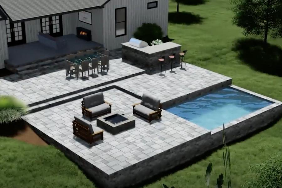 Paver patio with a seating area, outdoor kitchen and small pool surrounded by a lush green lawn.